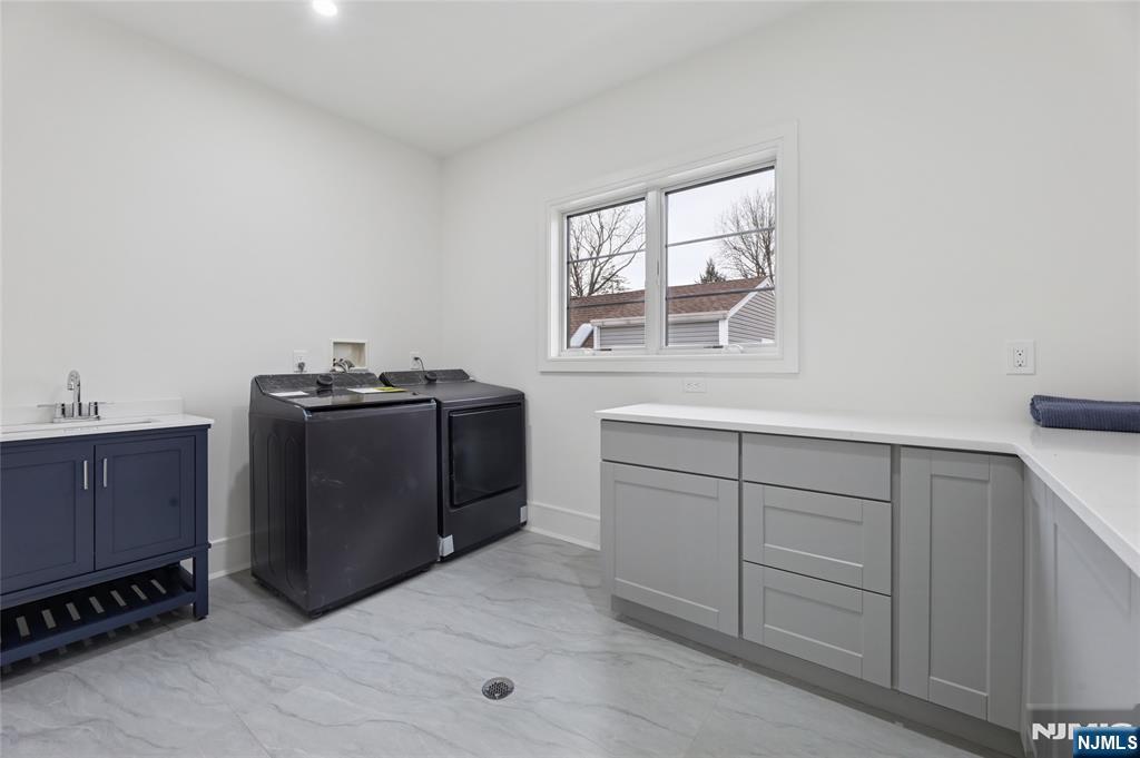 311 North Farview Avenue Paramus, NJ 07652 - Photo 39 of 50 a utility room with cabinets dryer and washer