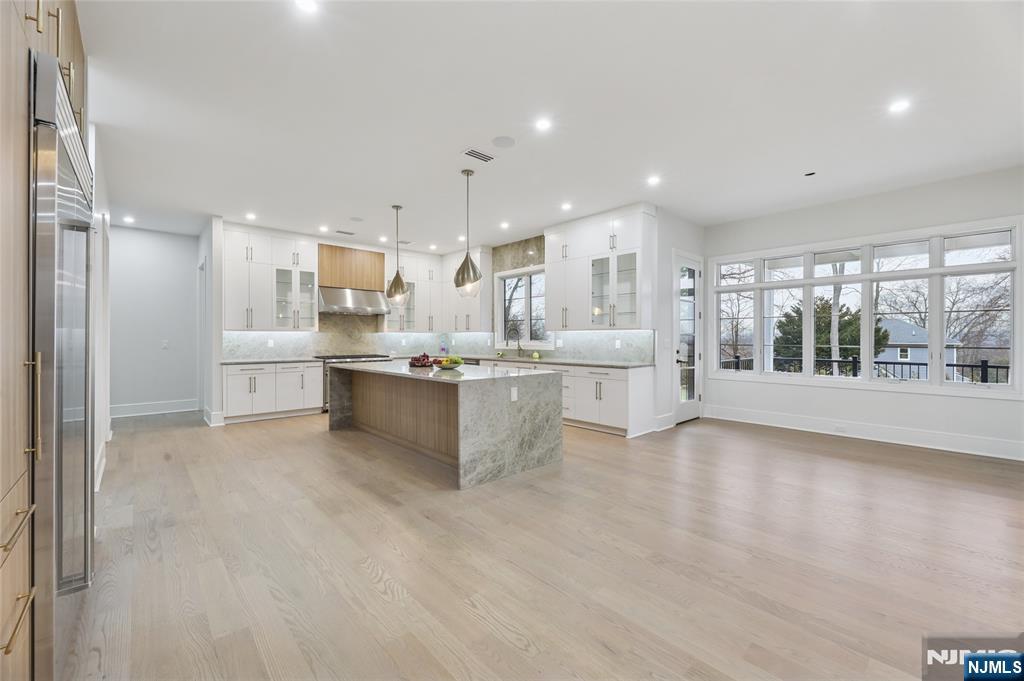 311 North Farview Avenue Paramus, NJ 07652 - Photo 10 of 50 a large white kitchen with a large window and stainless steel appliances