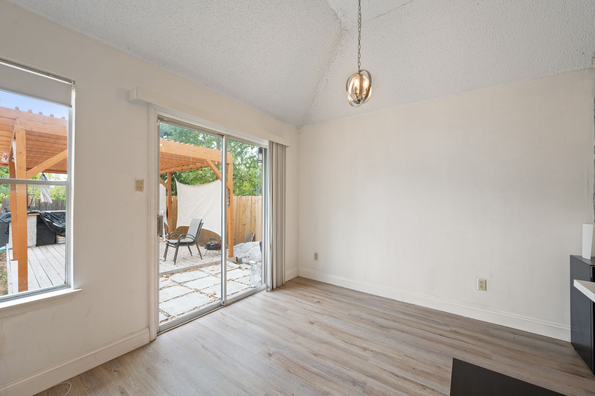 12501 Fallen Tower Lane Austin, TX 78753 - Photo 16 of 31 a view of a room with wooden floor and windows