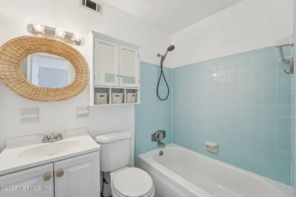 a bathroom with a sink a toilet and a bathtub