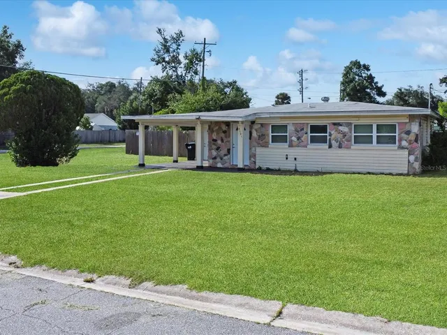 a view of a house with a big yard