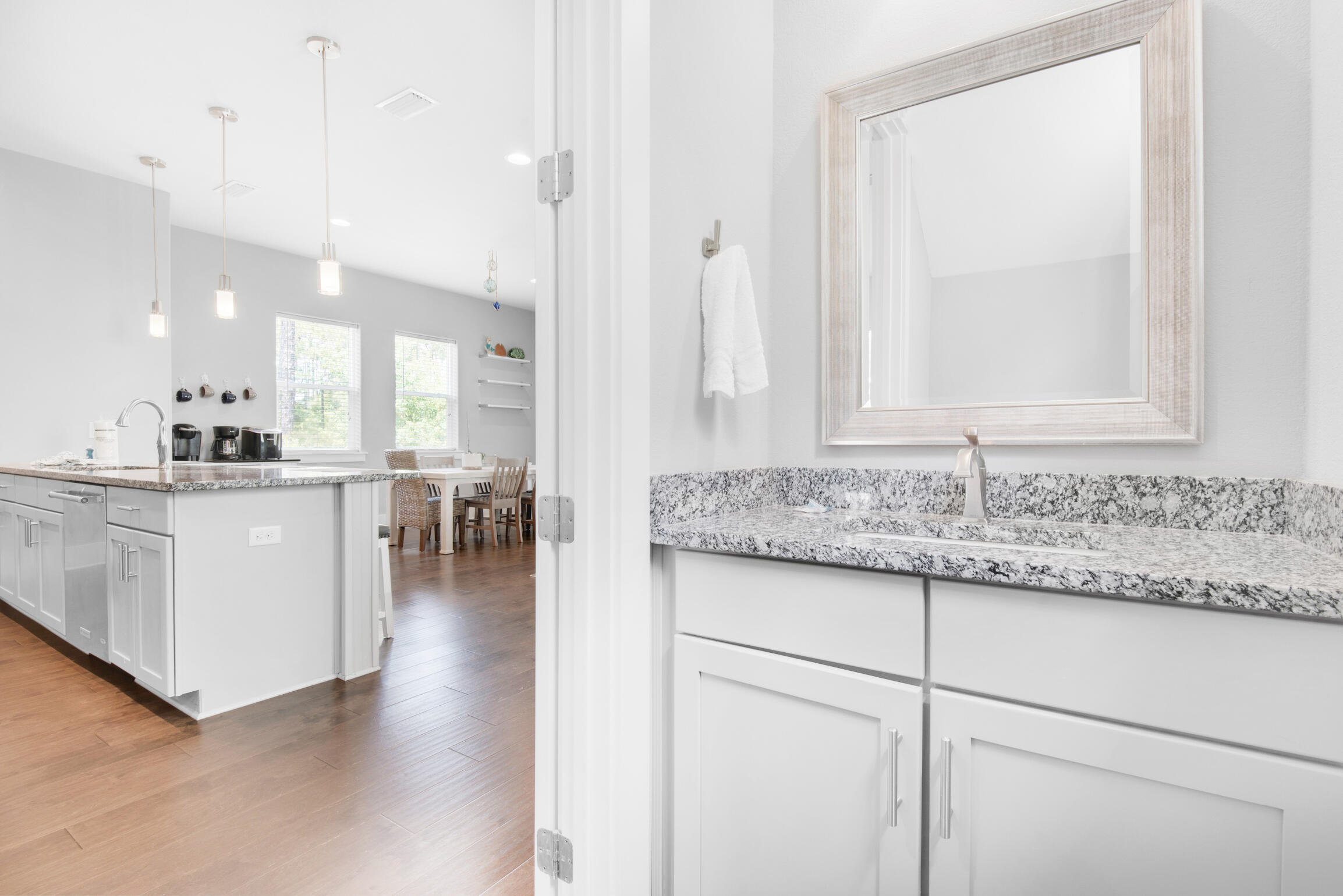 23 Mobile Street Miramar Beach, FL 32550 - Photo 33 of 49 a kitchen with stainless steel appliances granite countertop a sink and a white cabinets