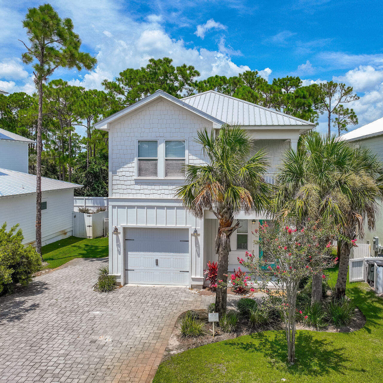 23 Mobile Street Miramar Beach, FL 32550 - Photo 40 of 49 a front view of a house with a yard and garage