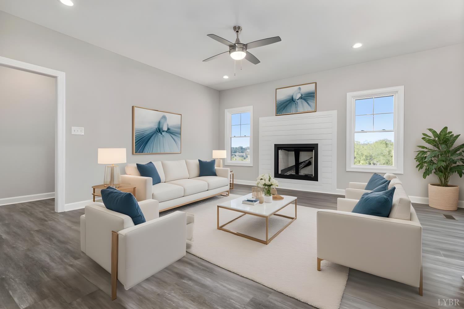 9768 Leesville Road Evington, VA 24550 - Photo 32 of 37 a living room with furniture a fireplace and a ceiling fan