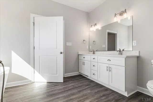 a bathroom with a double vanity sink and mirror