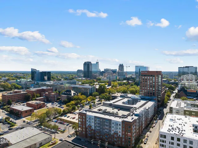 a view of a balcony with a sink and potted plants