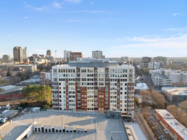 a view of a big room with a chandelier fan