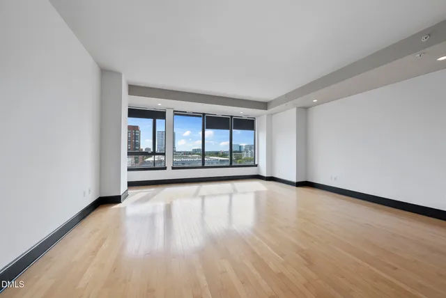 a kitchen with granite countertop a refrigerator and a sink