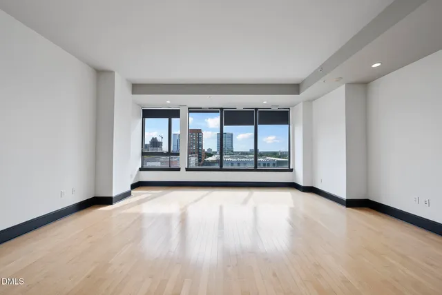 a kitchen with granite countertop a sink and cabinets