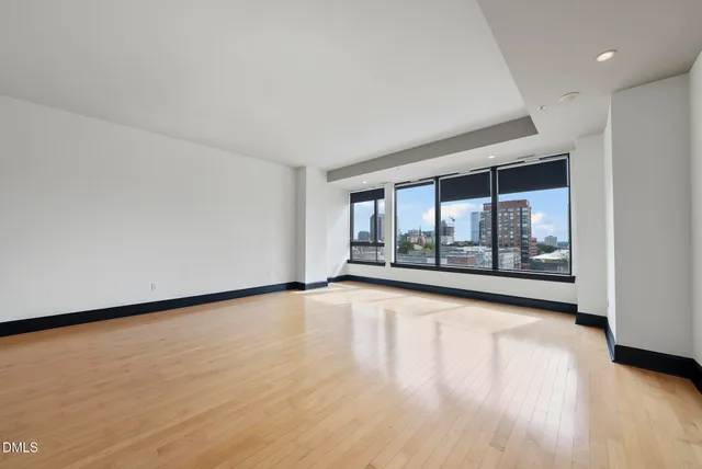 a kitchen with granite countertop a stove sink and cabinets