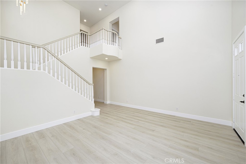 15 Plum Street Ladera Ranch, CA 92694 - Photo 18 of 113 a view of staircase with wooden floor and white walls