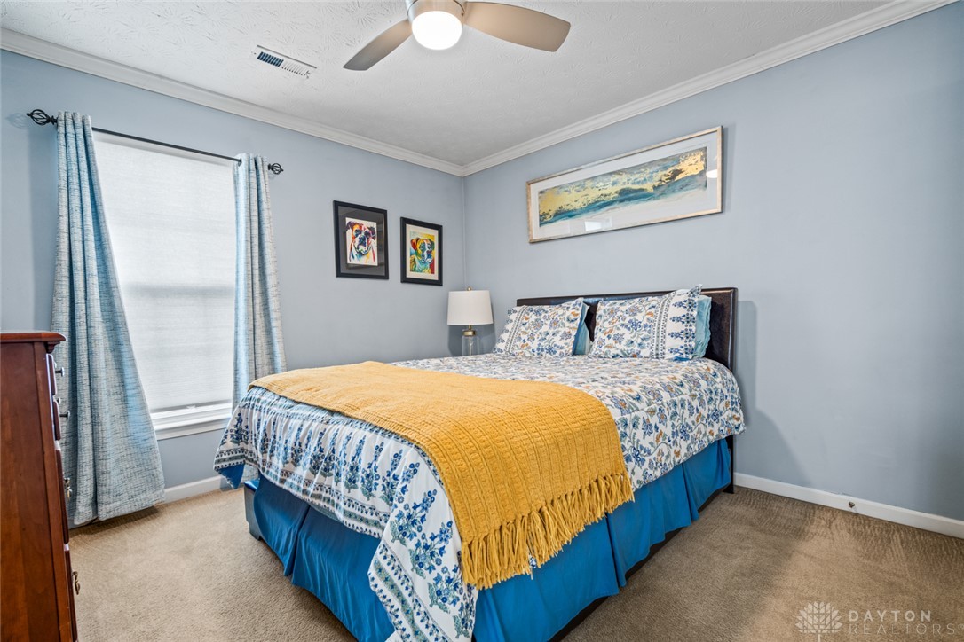 55 Janney Lane Springboro, OH 45066 - Photo 30 of 38 This restful bedroom offers soft carpet flooring and abundant natural light.