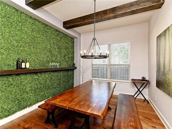 a view of a living room with furniture window and wooden floor