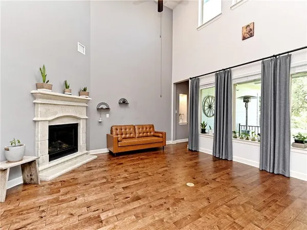 a spacious bedroom with a bed and a fireplace