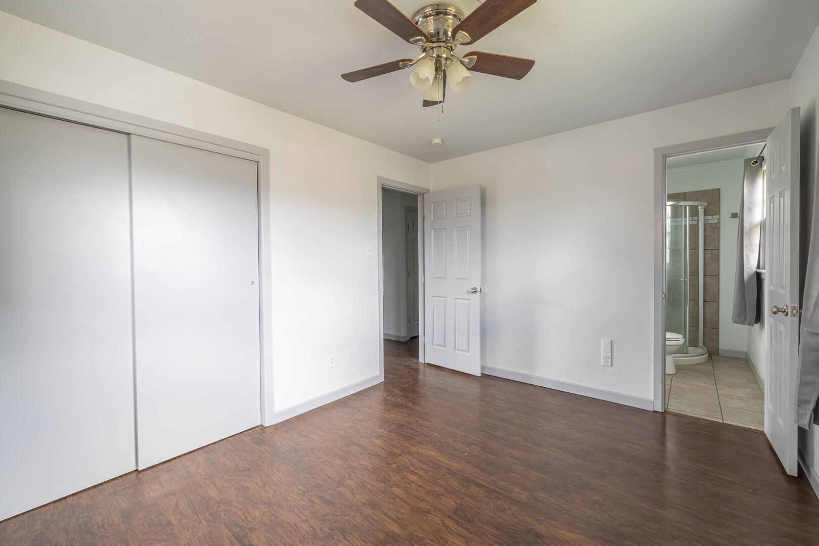 5403 13th Street Lubbock, TX 79416 - Photo 13 of 28 a view of an empty room and wooden floor