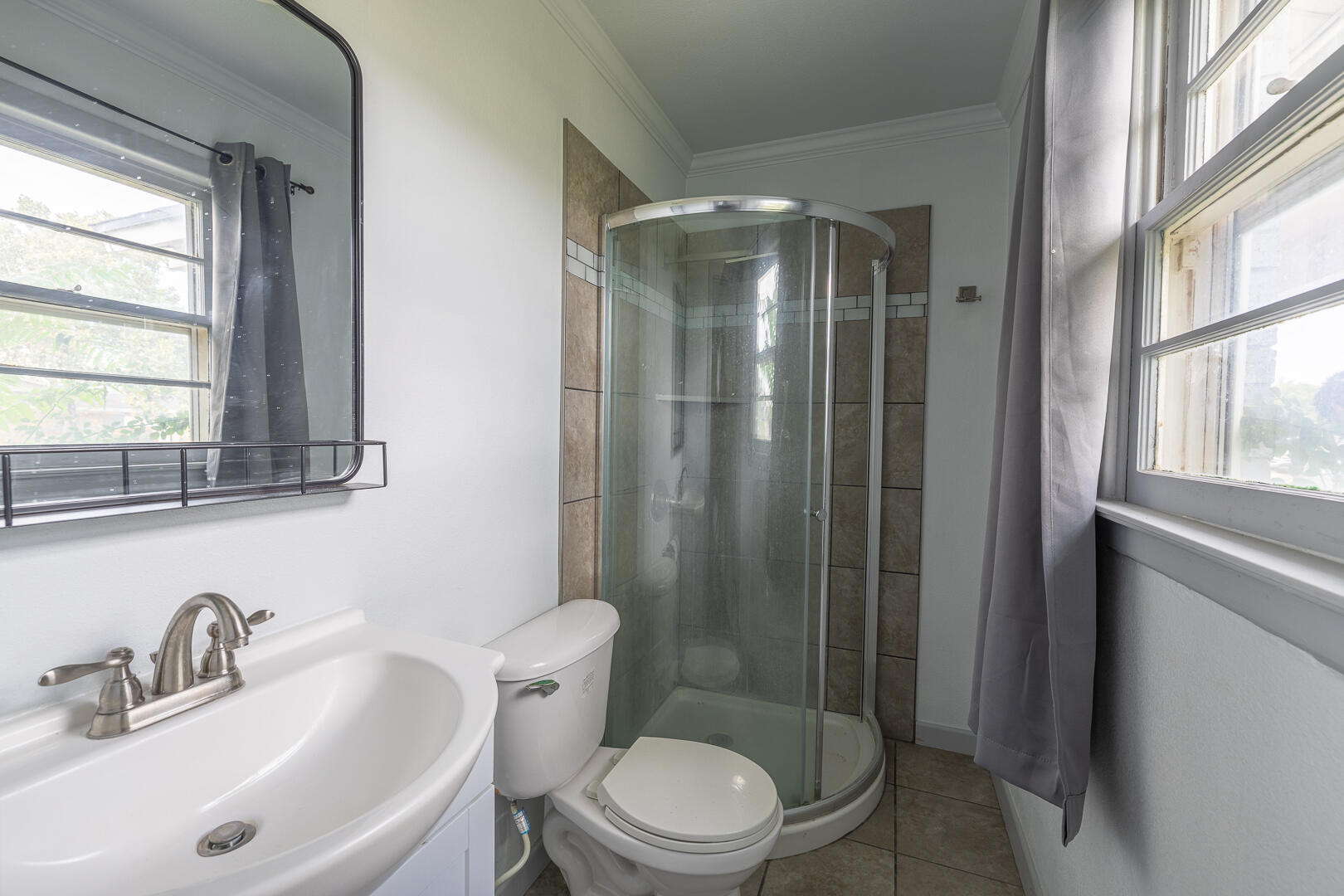 5403 13th Street Lubbock, TX 79416 - Photo 14 of 28 a bathroom with a sink toilet and shower