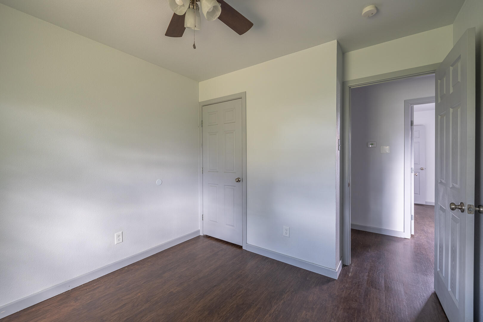 5403 13th Street Lubbock, TX 79416 - Photo 22 of 28 an empty room with wooden floor and windows
