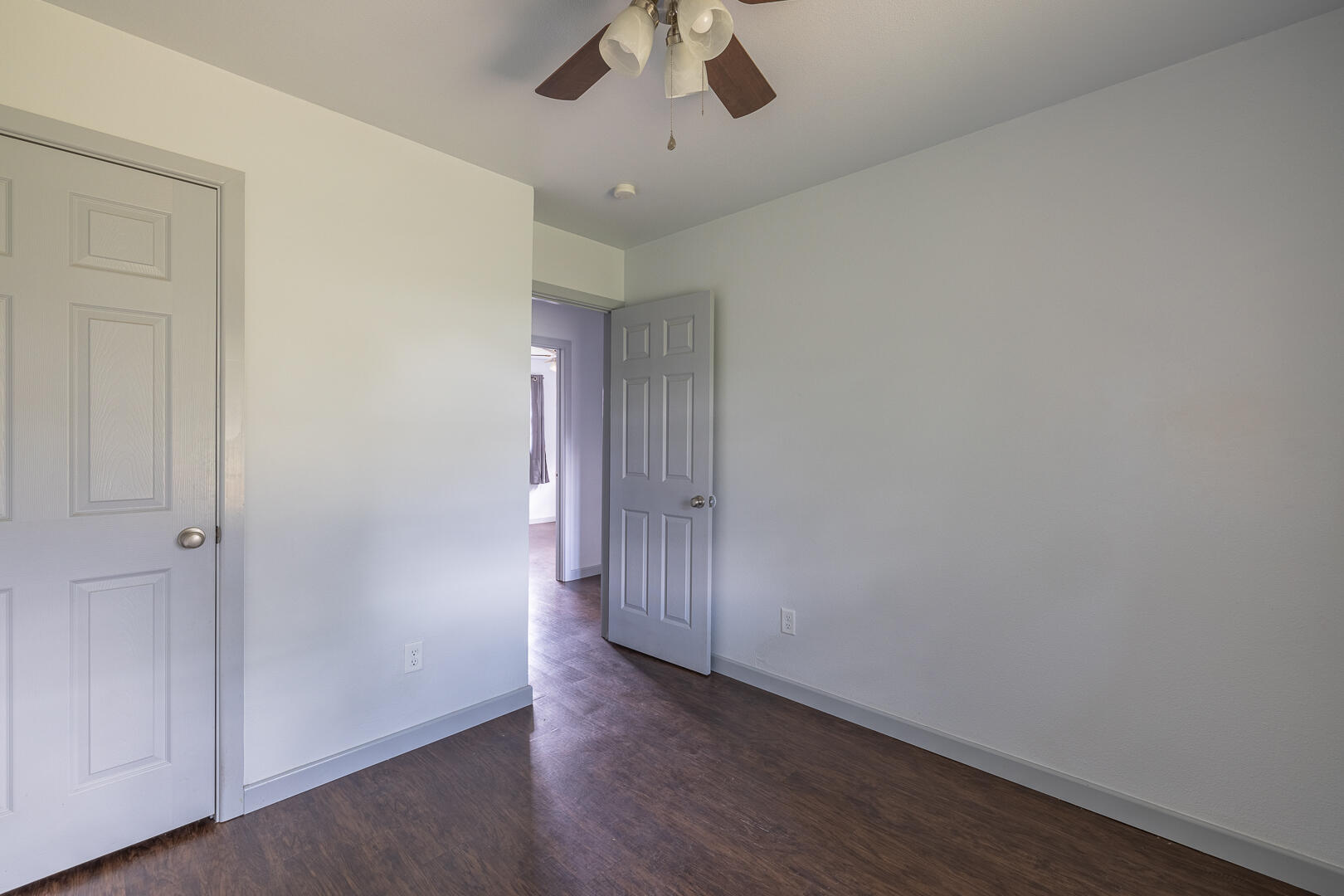 5403 13th Street Lubbock, TX 79416 - Photo 23 of 28 an empty room with a hardwood and ceiling fan