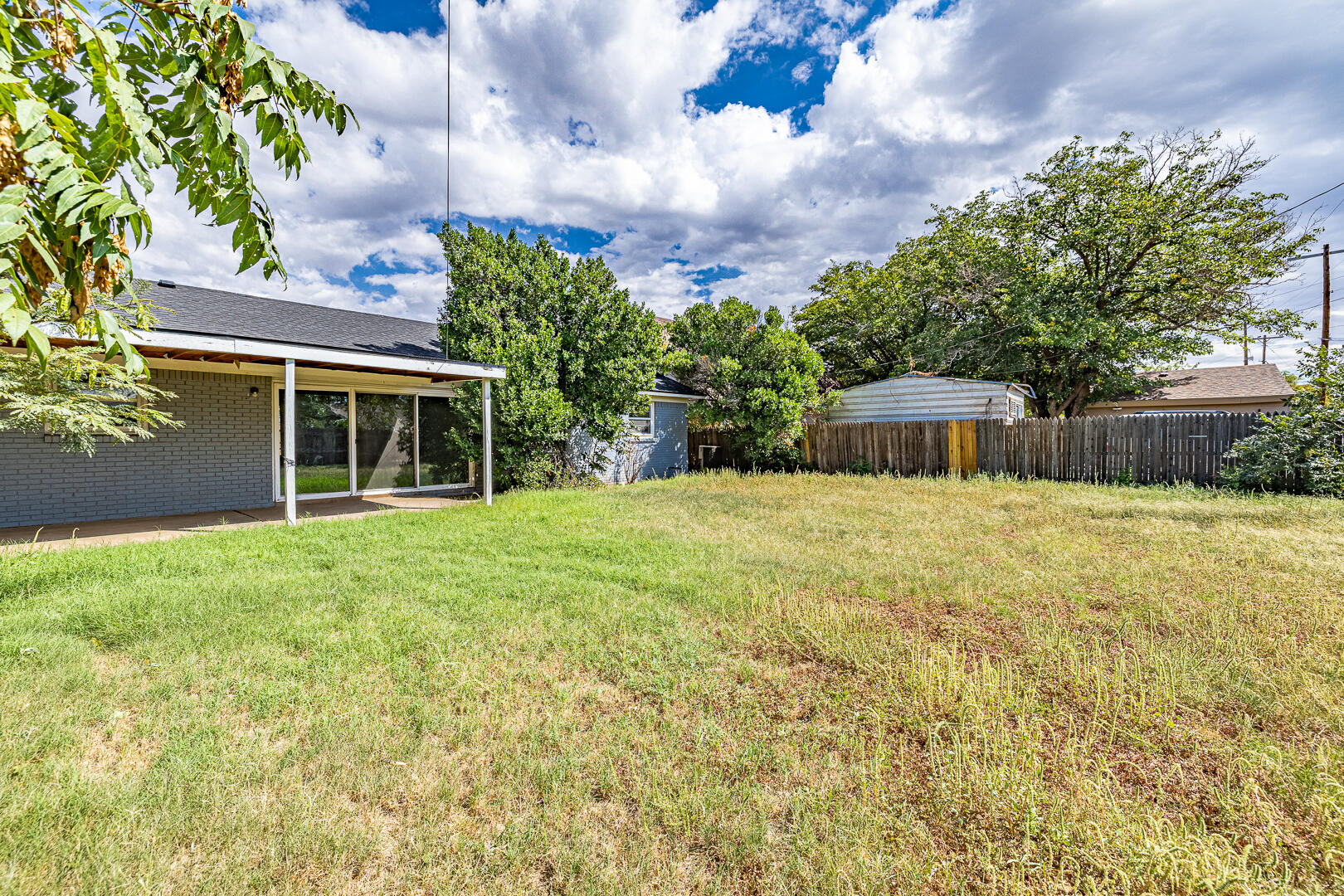 5403 13th Street Lubbock, TX 79416 - Photo 26 of 28 a swimming pool with outdoor seating and yard