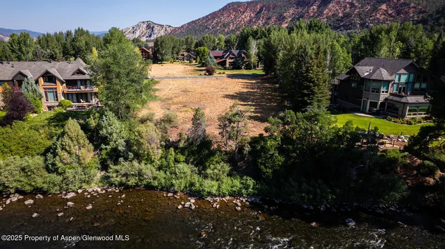 a view of a city with mountains in the background