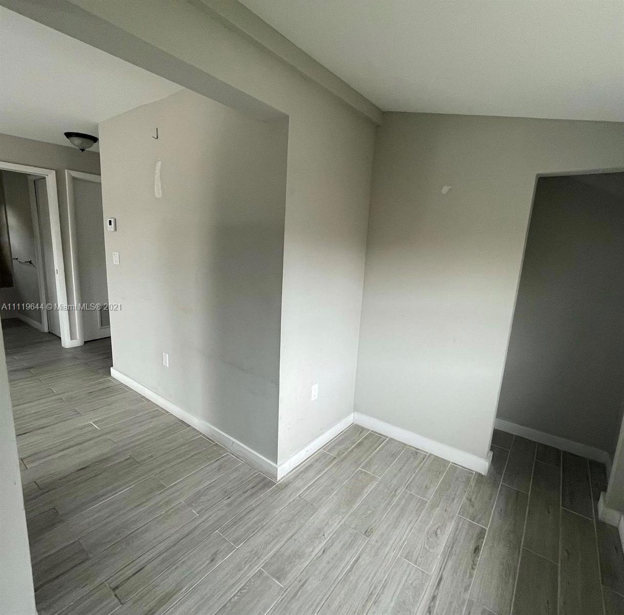 1035 Northwest 5th Street, Unit 3 Miami, FL 33128 - Photo 6 of 6 wooden floor in an empty room