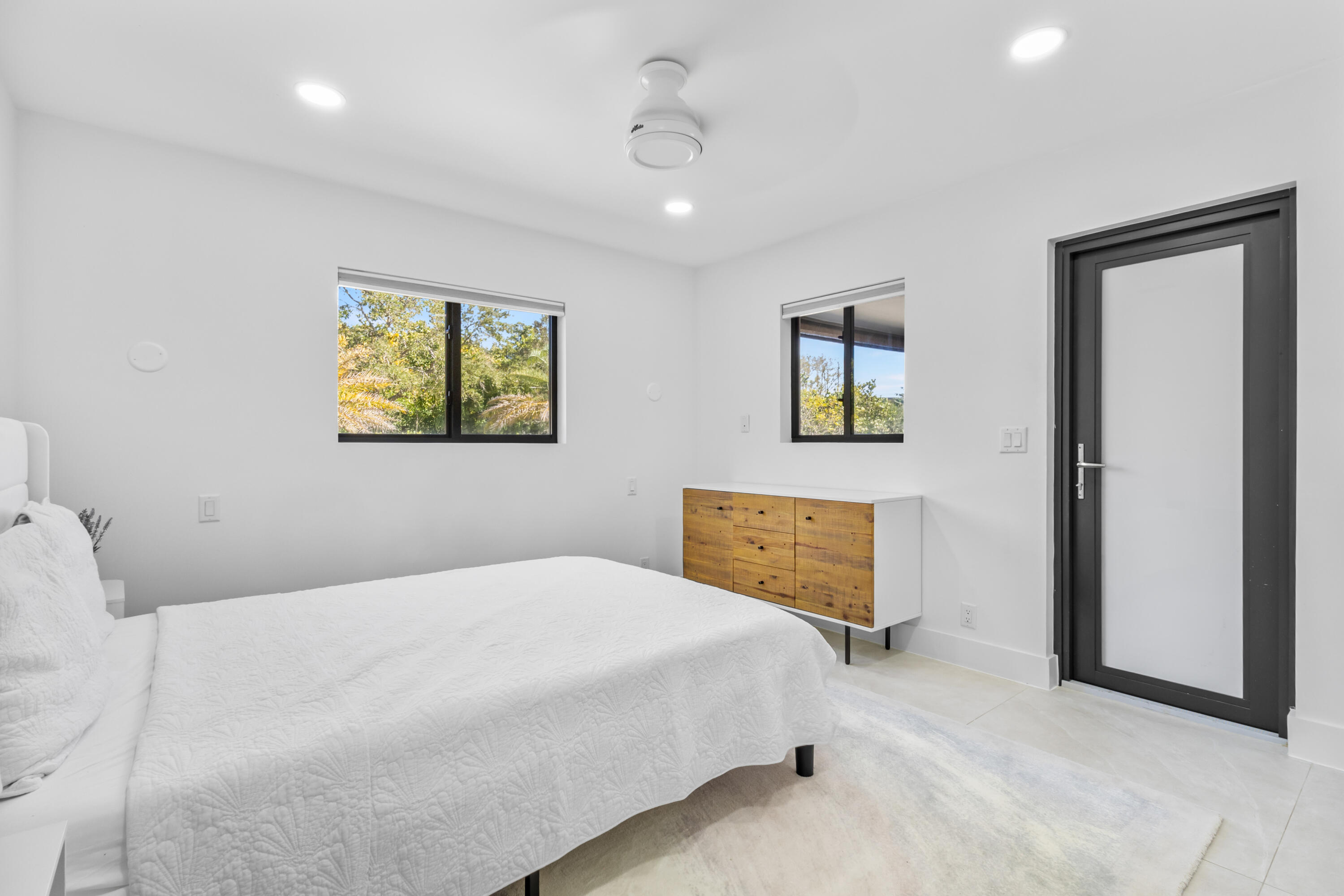 501 High Street Boca Raton, FL 33432 - Photo 12 of 27 a bedroom with a bed and a painting on the wall