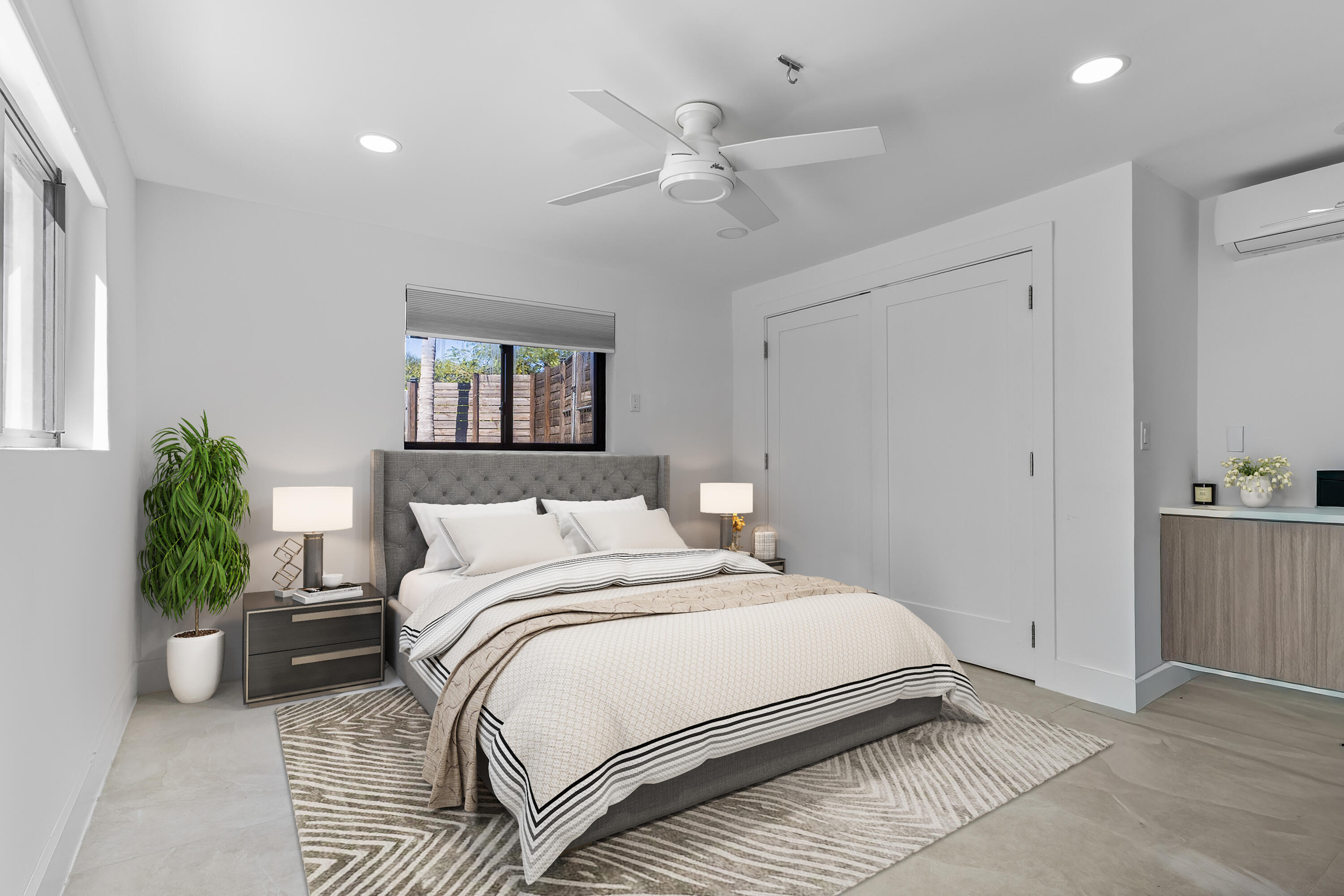 501 High Street Boca Raton, FL 33432 - Photo 14 of 27 a bedroom with a large bed and a chandelier