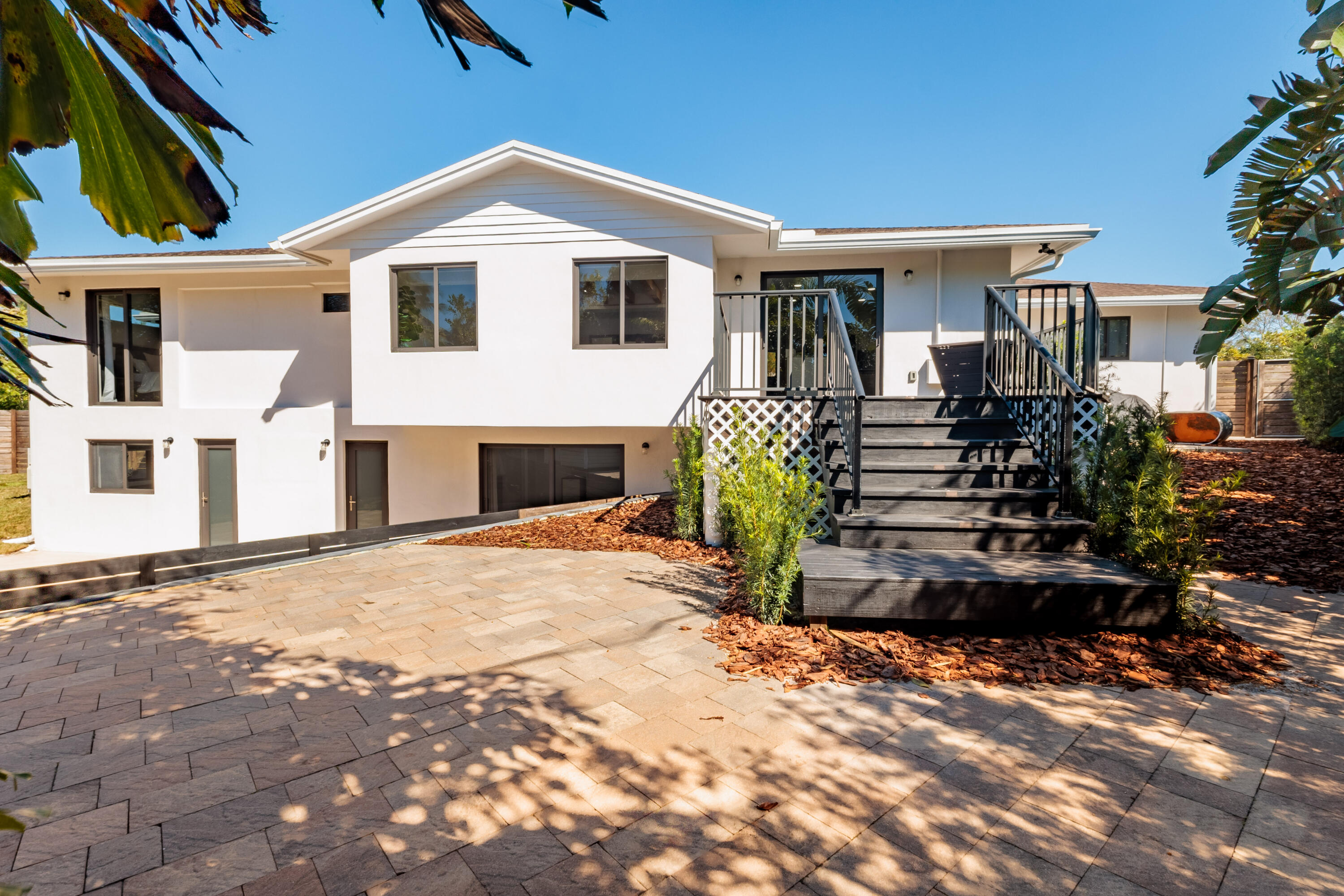 501 High Street Boca Raton, FL 33432 - Photo 18 of 27 a front view of a house with a patio
