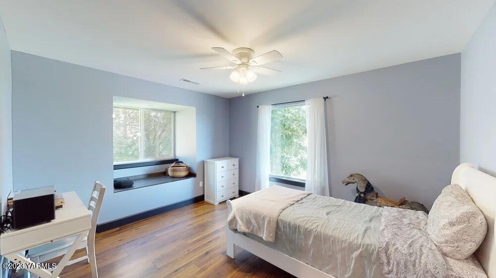 14751 Cottonwood Canyon Road Yakima, WA 98908 - Photo 21 of 53 a bedroom with a bed and a window