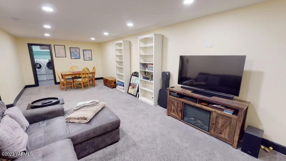 14751 Cottonwood Canyon Road Yakima, WA 98908 - Photo 26 of 53 a living room with furniture and a flat screen tv