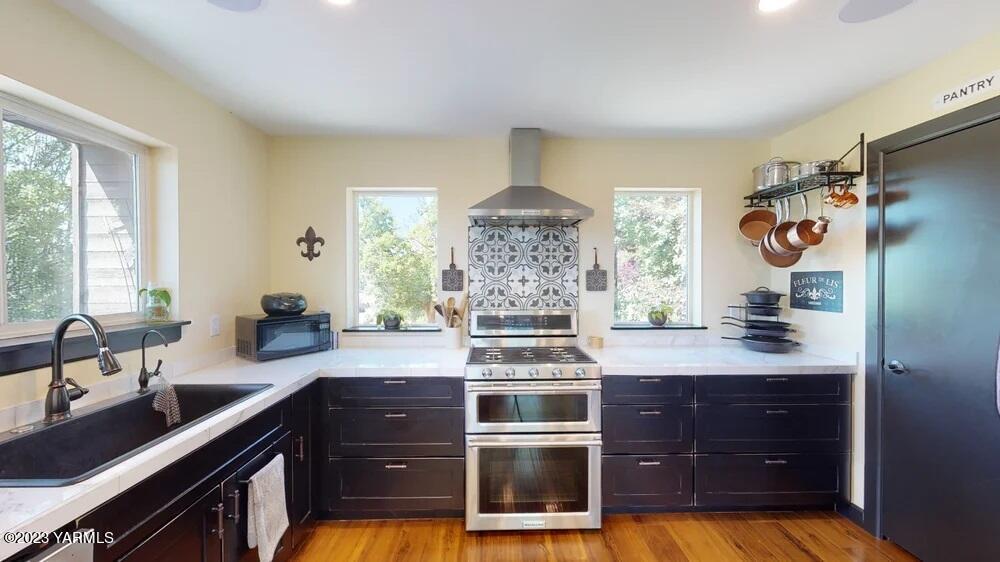 14751 Cottonwood Canyon Road Yakima, WA 98908 - Photo 3 of 53 a kitchen with stainless steel appliances granite countertop a stove and a sink
