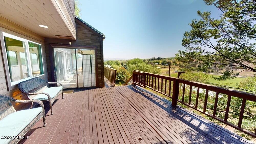 14751 Cottonwood Canyon Road Yakima, WA 98908 - Photo 33 of 53 a balcony with wooden floor and furniture
