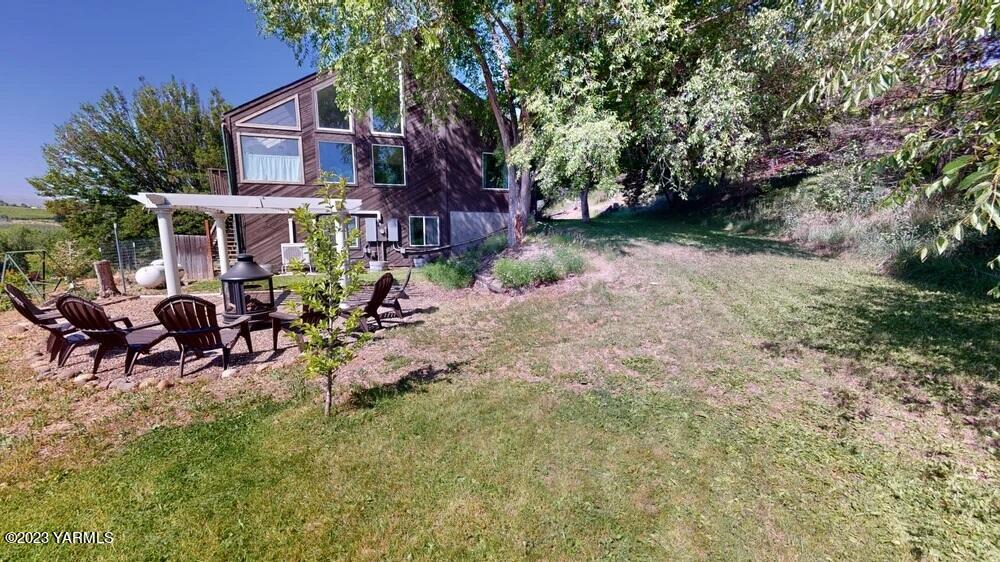 14751 Cottonwood Canyon Road Yakima, WA 98908 - Photo 34 of 53 a view of a house with backyard and sitting area