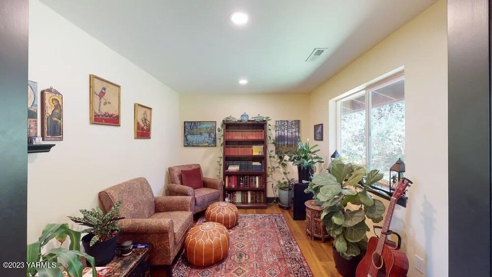 14751 Cottonwood Canyon Road Yakima, WA 98908 - Photo 7 of 53 a living room with furniture and a potted plant