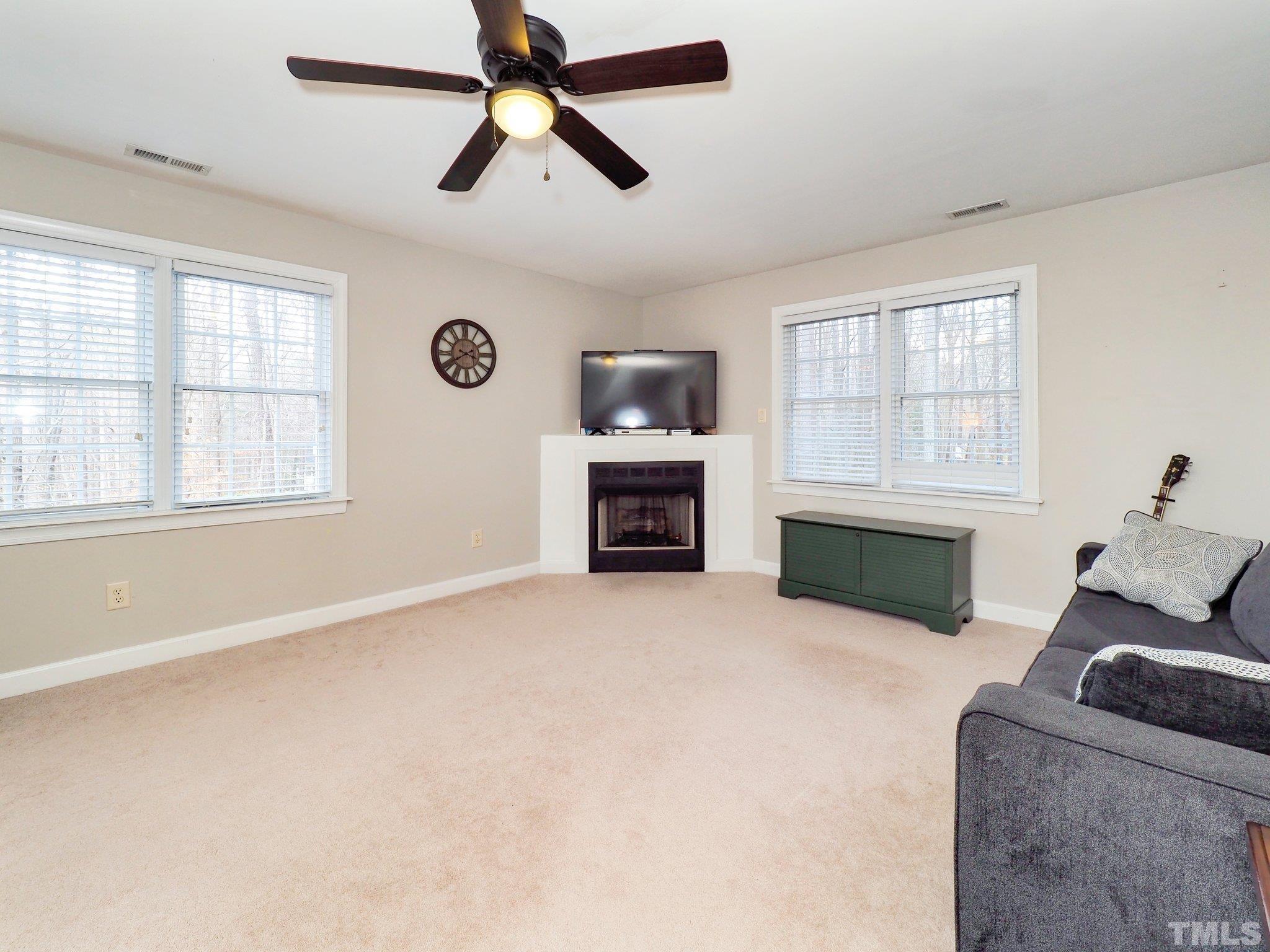 4412 Black Lion Way Raleigh, NC 27610 - Photo 17 of 32 a living room with furniture and a window
