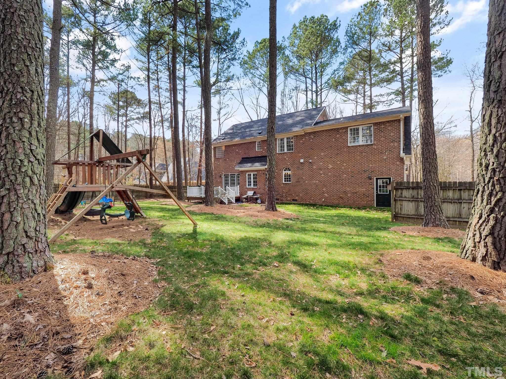 4412 Black Lion Way Raleigh, NC 27610 - Photo 28 of 32 a view of backyard with a garden and plants
