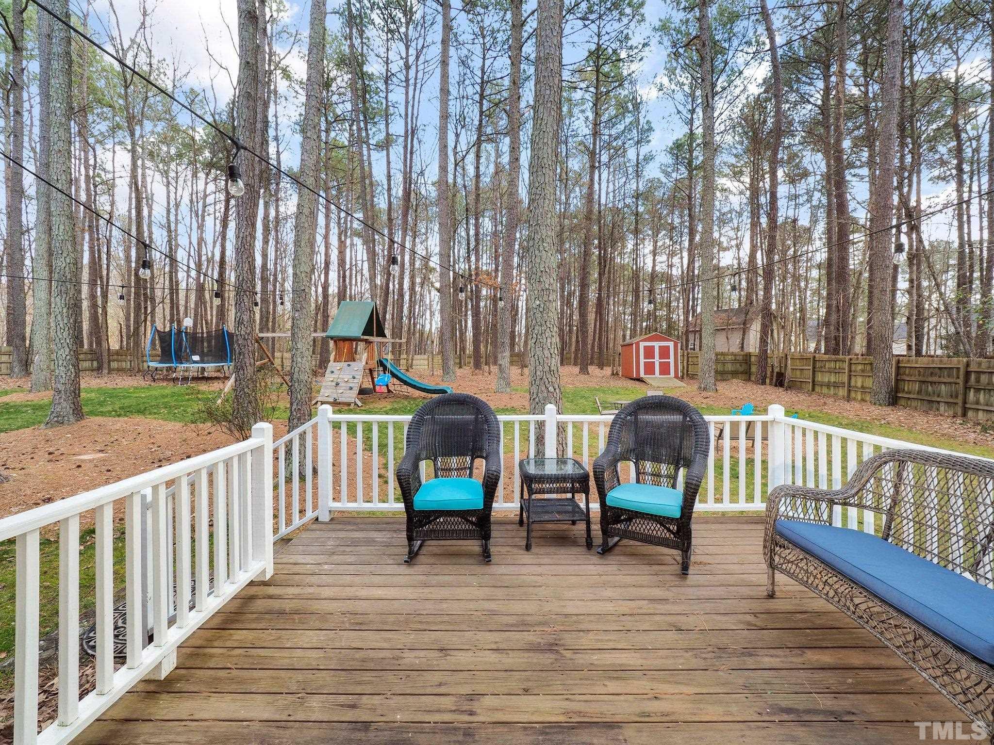4412 Black Lion Way Raleigh, NC 27610 - Photo 32 of 32 a view of outdoor space with seating and trees