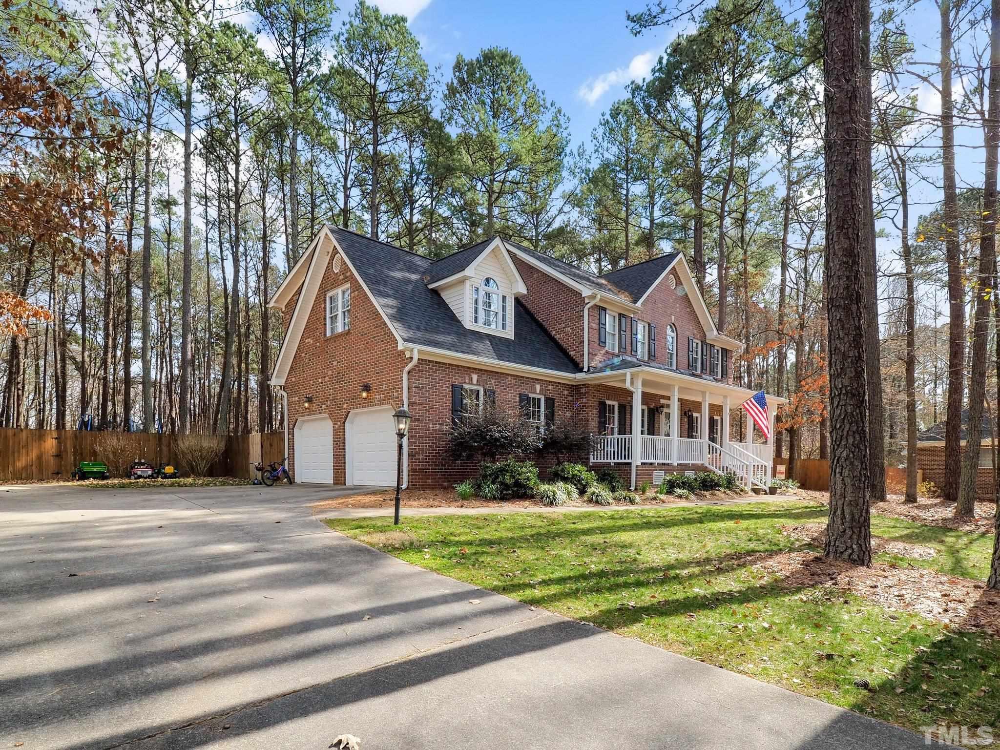 4412 Black Lion Way Raleigh, NC 27610 - Photo 4 of 32 a front view of a house with a yard