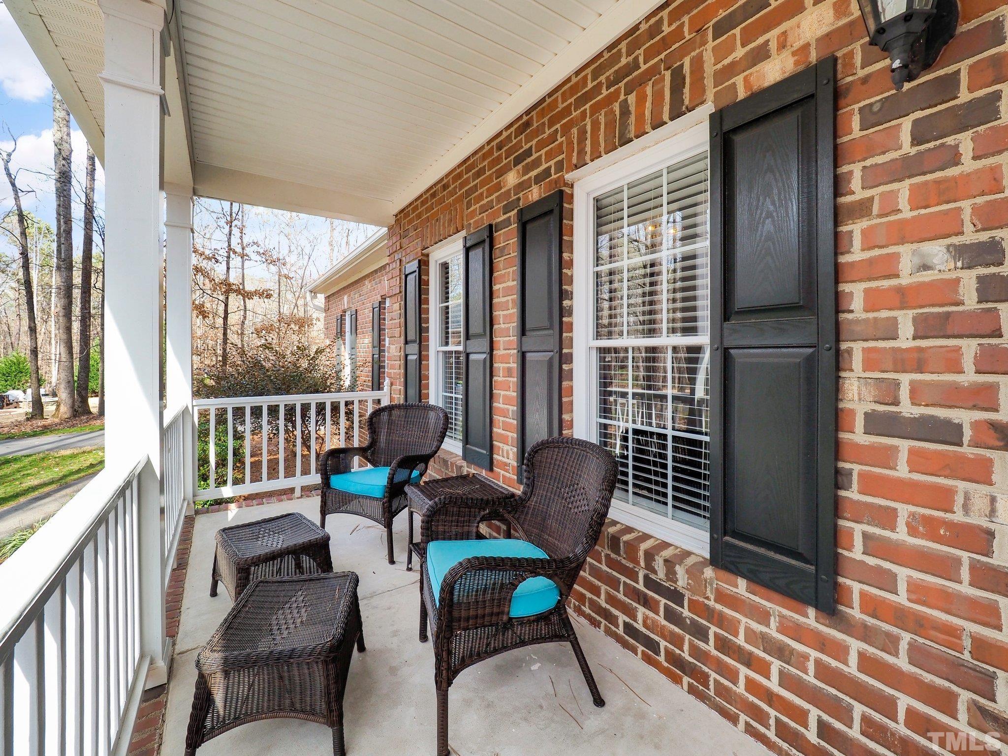 4412 Black Lion Way Raleigh, NC 27610 - Photo 7 of 32 a balcony with chairs and outdoor view