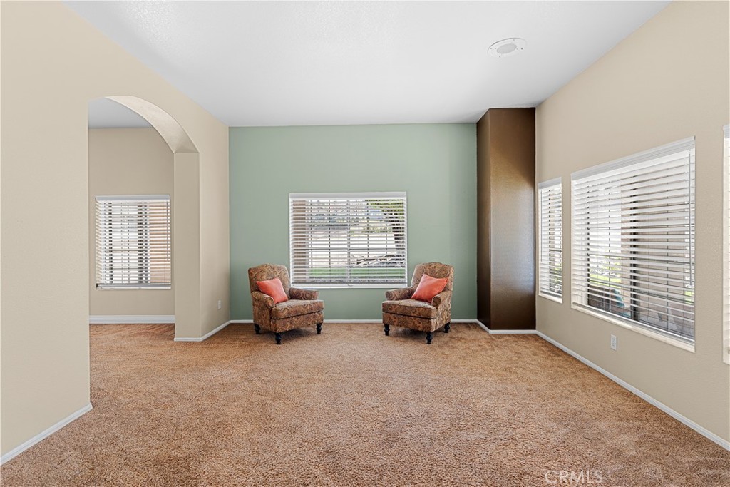 17492 Mariposa Avenue Riverside, CA 92504 - Photo 12 of 43 a living room with furniture and large windows