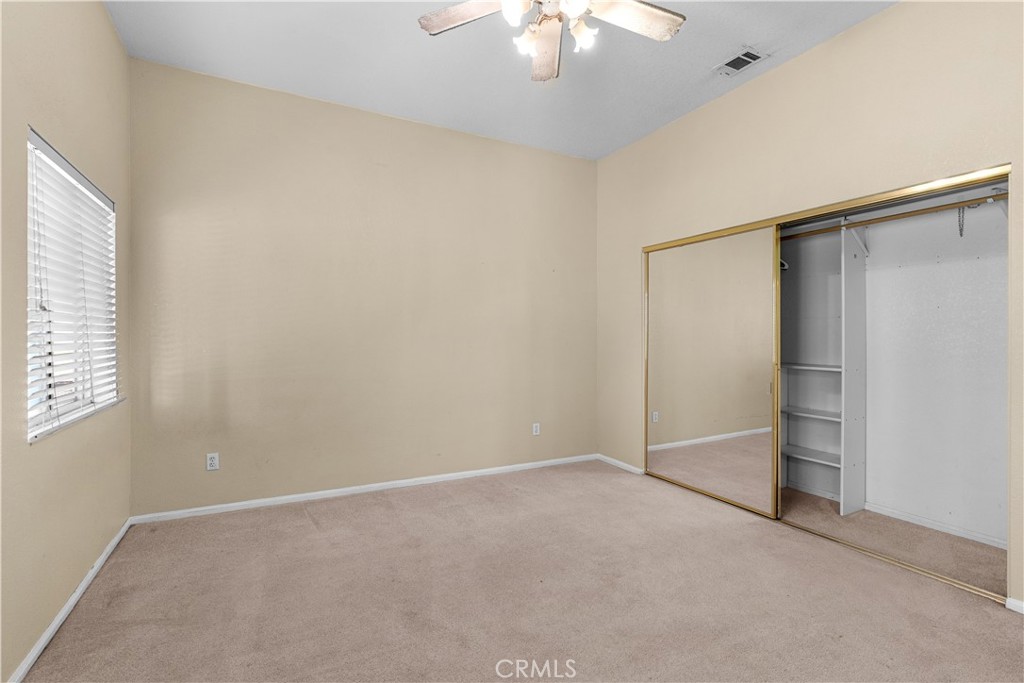 17492 Mariposa Avenue Riverside, CA 92504 - Photo 41 of 43 an empty room with a empty space and a ceiling fan