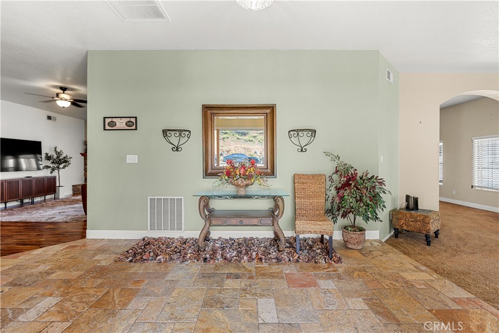 17492 Mariposa Avenue Riverside, CA 92504 - Photo 10 of 43 a living room with furniture and a potted plant