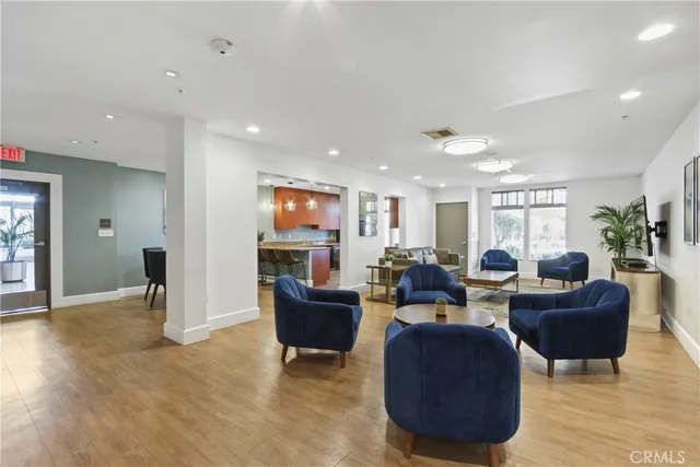 a living room with fireplace furniture and a flat screen tv