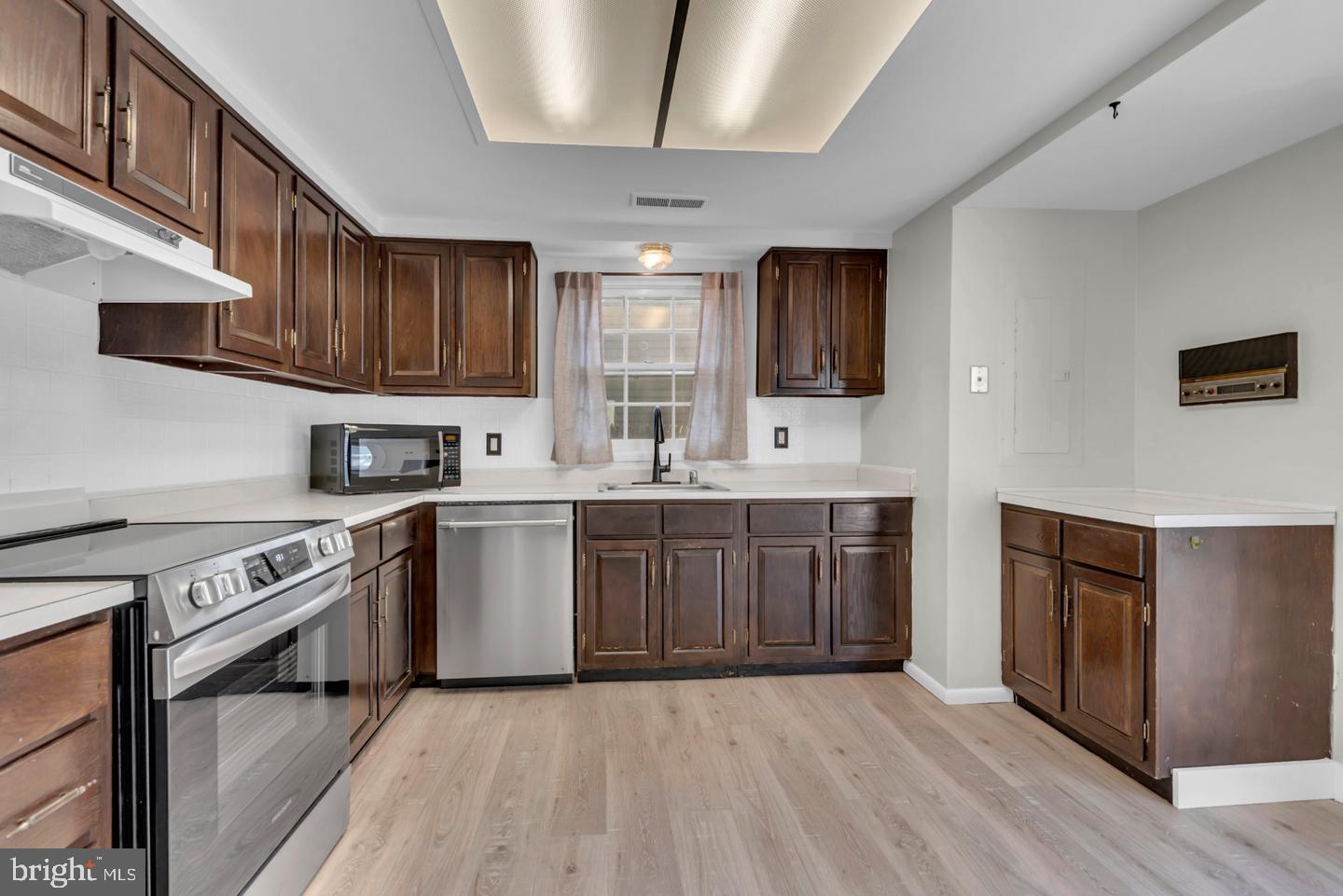 1836 Ralston Place Crofton, MD 21114 - Photo 11 of 42 Modern kitchen with rich wood tones.