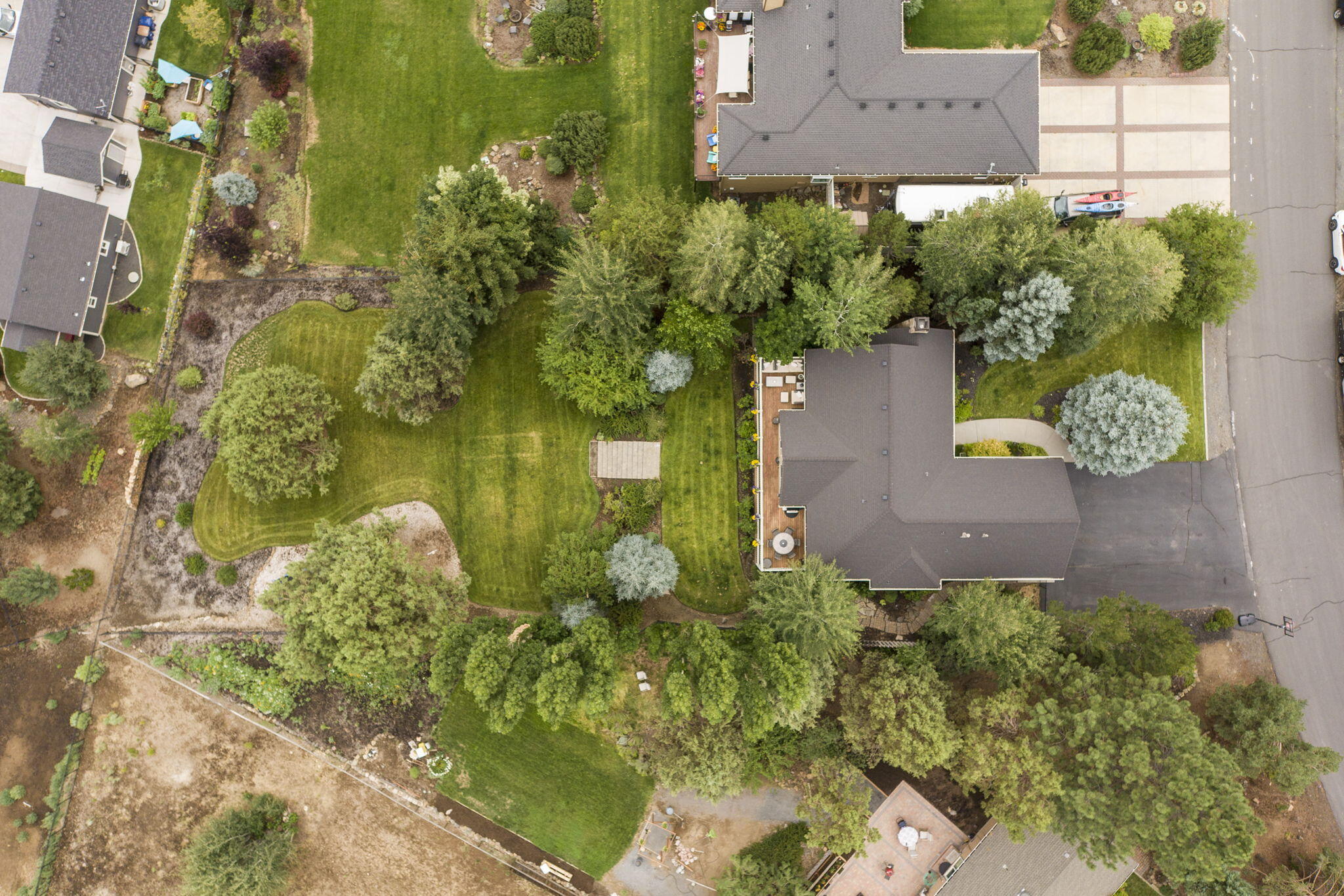 61538 Southeast Hill Ridge Road Bend, OR 97702 - Photo 3 of 59 an aerial view of a house with a yard swimming pool outdoor seating and yard