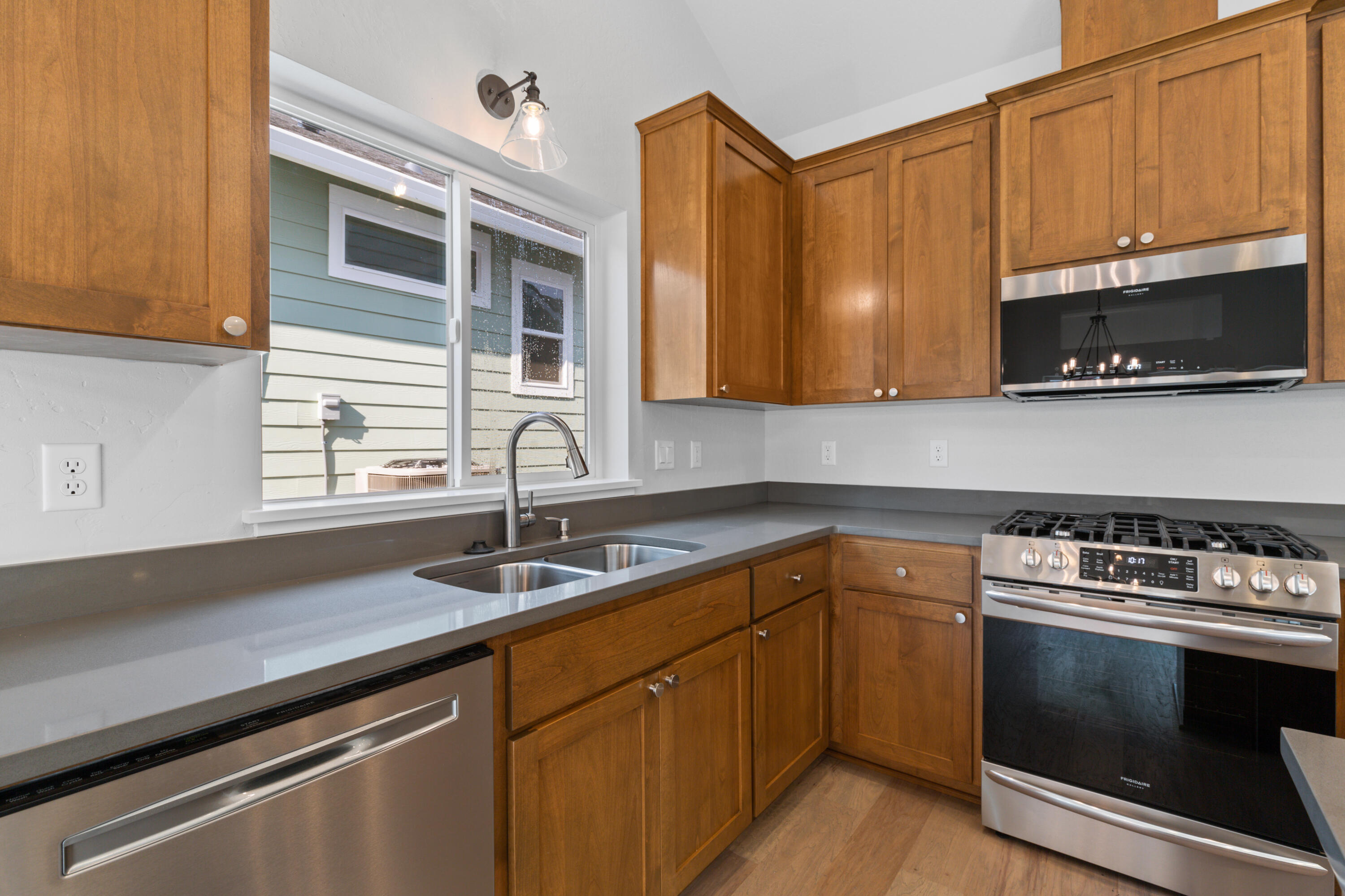 220 Autumn Ridge Road Talent, OR 97540 - Photo 8 of 27 Five burner gas stove, stainless appliances and under-counter sink.