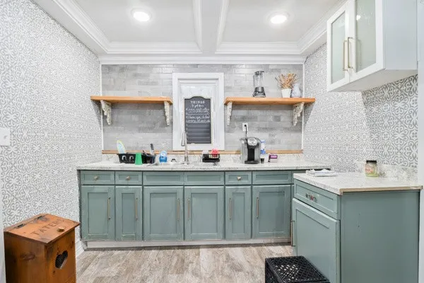 a kitchen with stainless steel appliances a sink and cabinets