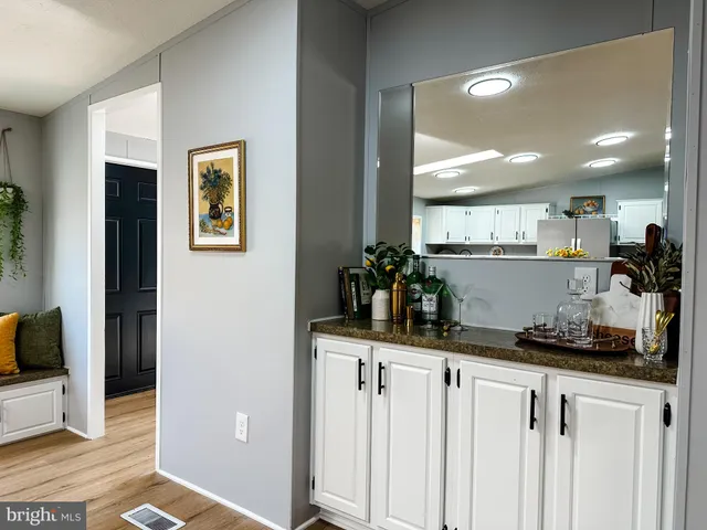 a kitchen with stainless steel appliances a sink and cabinets