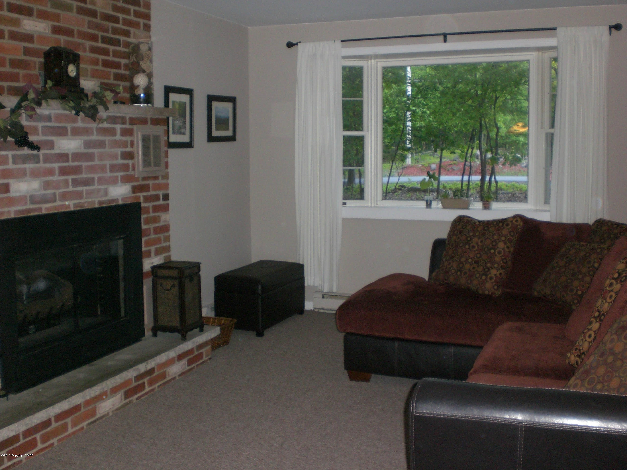 5 Laurelwood Road Swiftwater, PA 18370 - Photo 8 of 17 a living room with furniture and a fireplace