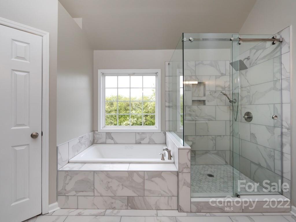 2721 Gosling Terrace Road Charlotte, NC 28262 - Photo 18 of 29 a bathroom with a bathtub and shower
